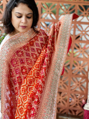 Red, Orange Handwoven NeemZari Bareek Bandhani with Gotapatti Handwork in Pure Georgette