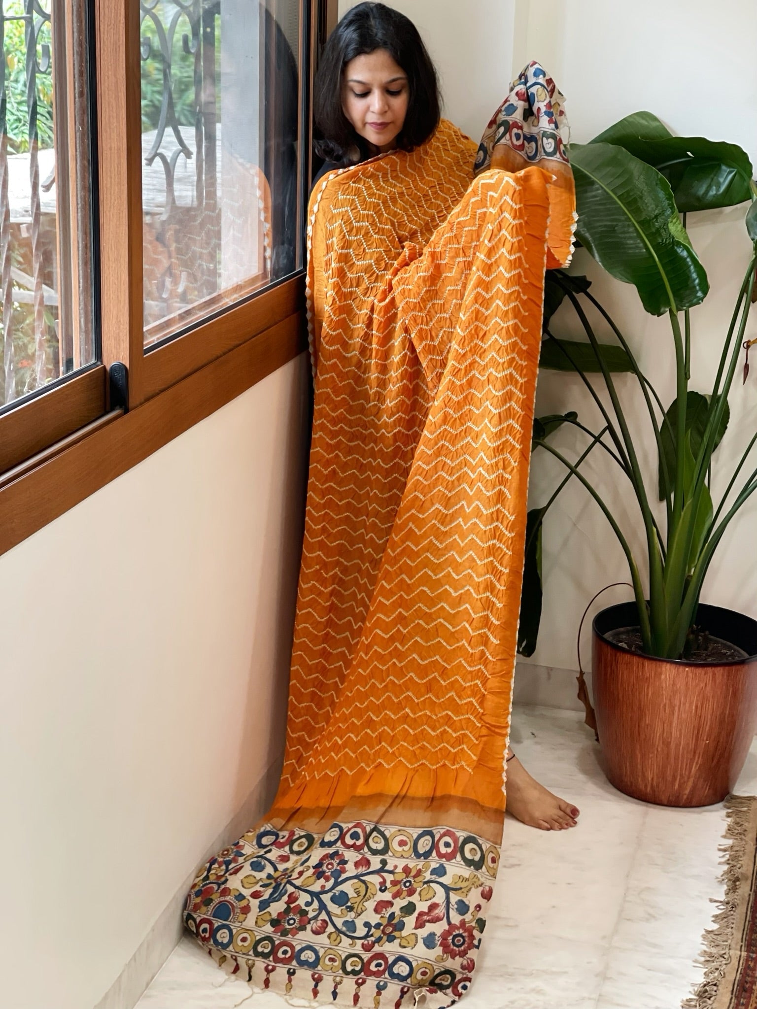 Orange Rai Bandhej Dupatta with Handpainted Kalamkari Pallu in Pure Muga Silk - Masakalee
