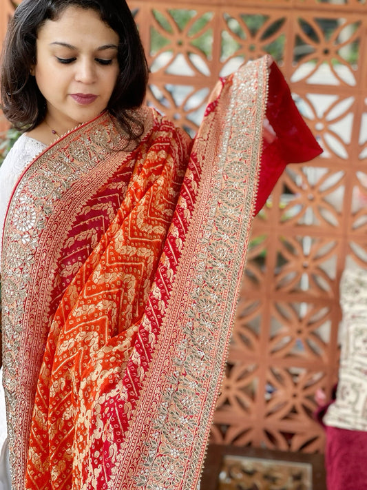 Orange, Red Handwoven NeemZari Bareek Bandhani with Gotapatti Handwork in Pure Georgette - Masakalee