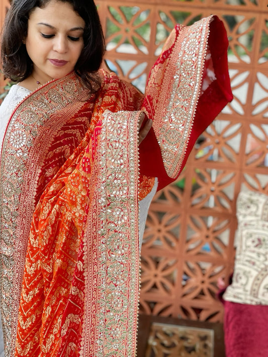 Orange, Red Handwoven NeemZari Bareek Bandhani with Gotapatti Handwork in Pure Georgette