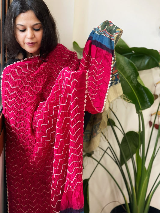 Pinkish Red  Rai Bandhej Dupatta with Handpainted Kalamkari Pallu in Pure Muga Silk
